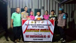 Peringati HUT Bhayangkara ke-80, Polsek Tongauna Tabur Bunga dan Salurkan Bantuan Sembako kepada Warga